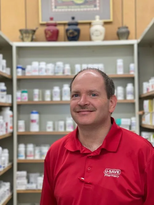 Robbie Price, PharmD, inside U-Save Pharmacy